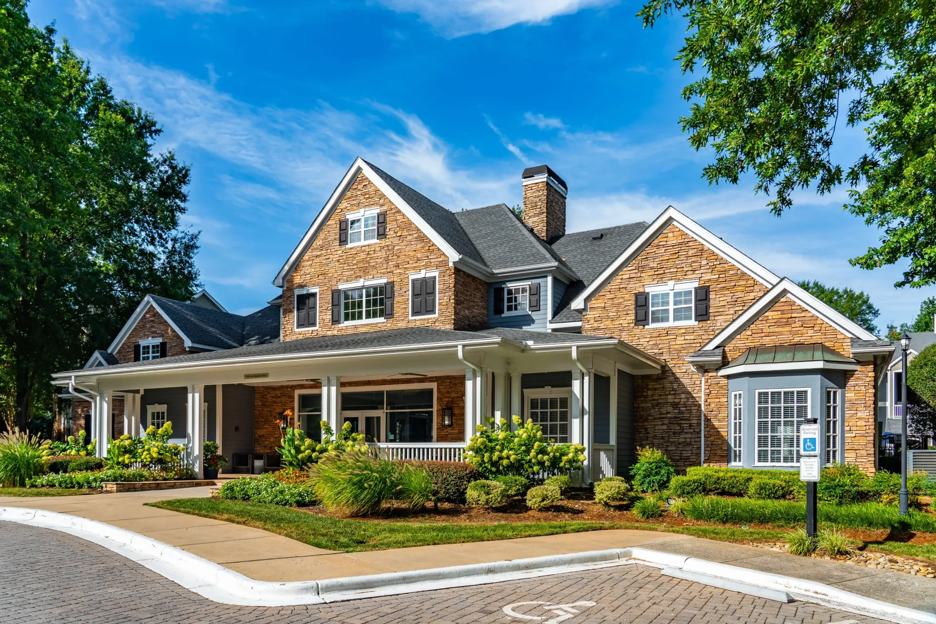 Building exterior with stone accents and a covered porch.