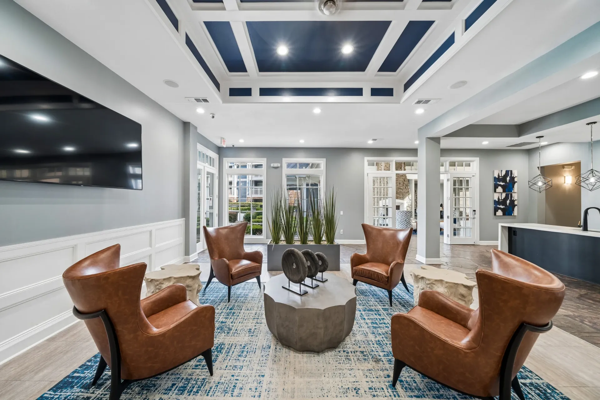 Lobby seating area with leather chairs and modern coffee table
