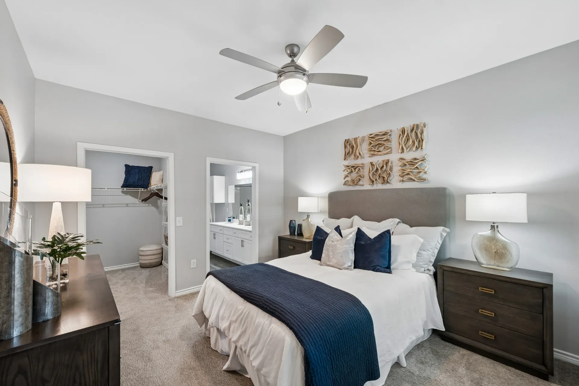 Luxurious bedroom with a king-size bed, walk-in closet, and en-suite bathroom.