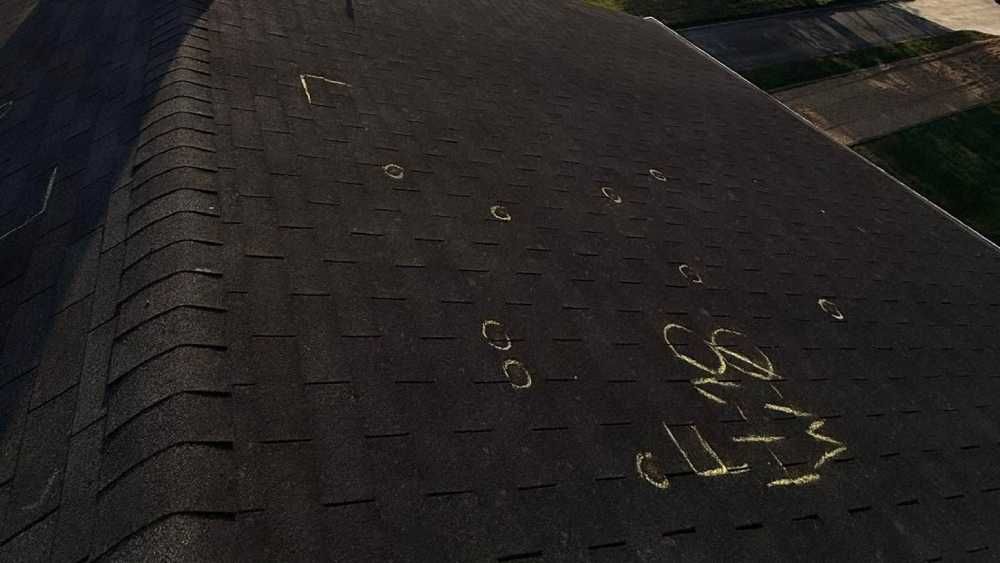 A residential roof with hail damage for inspection  in Huntsville AL by LJ Roofing
