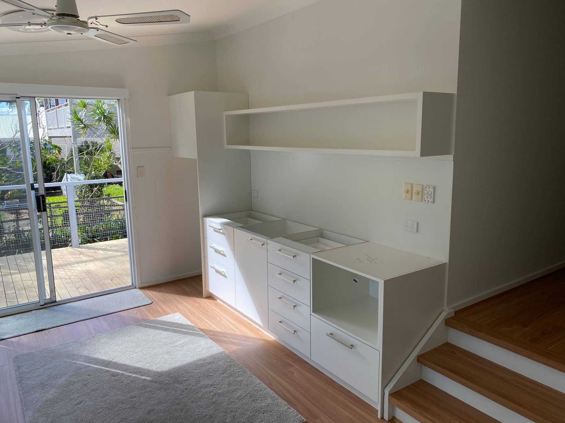 White Kitchen Cabinets With a Long Shelf — Trim Joinery In Fountaindale, NSW
