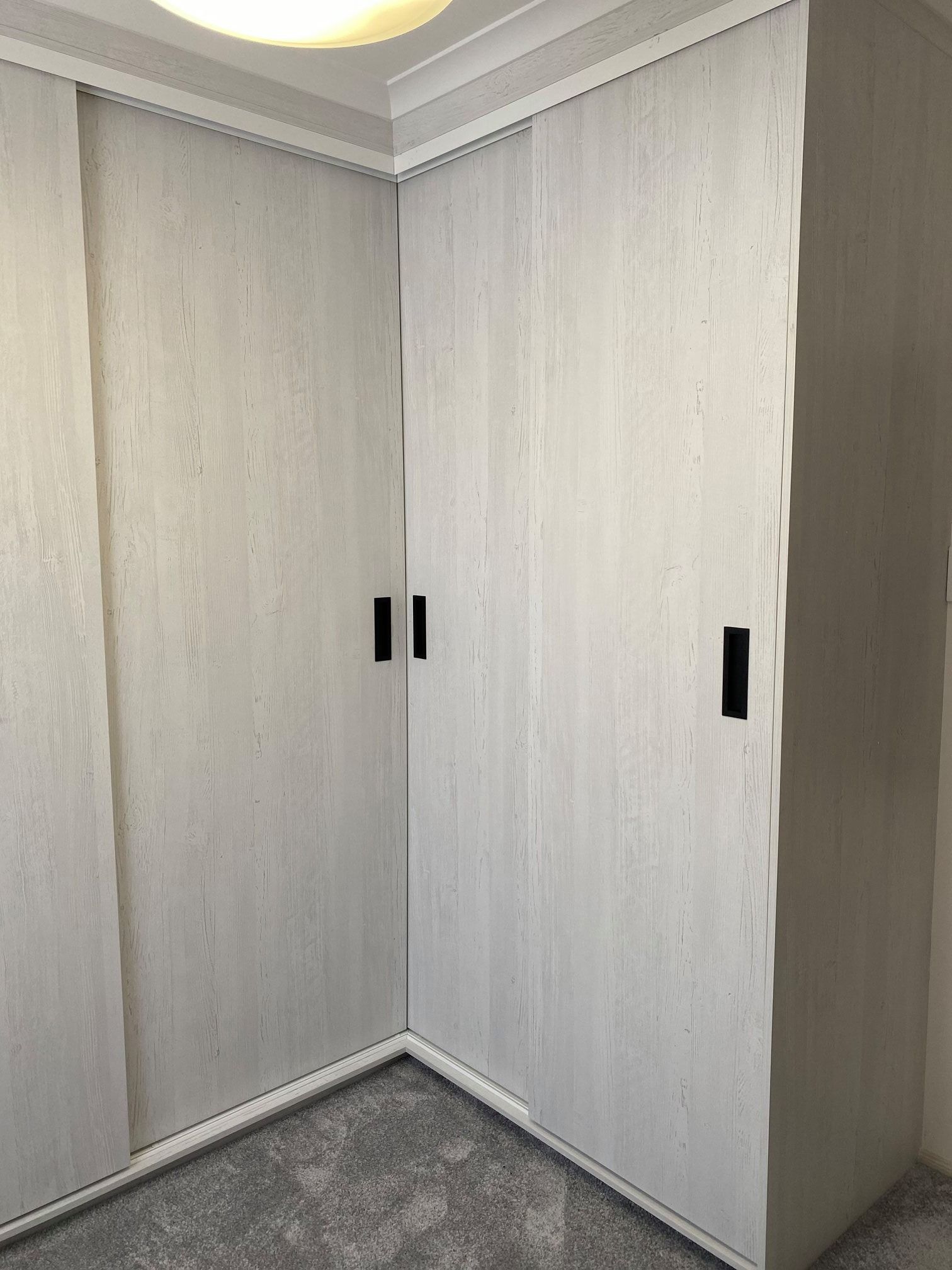 Corner Closet With Light Wood-grain Doors — Trim Joinery In Hunter Valley, NSW