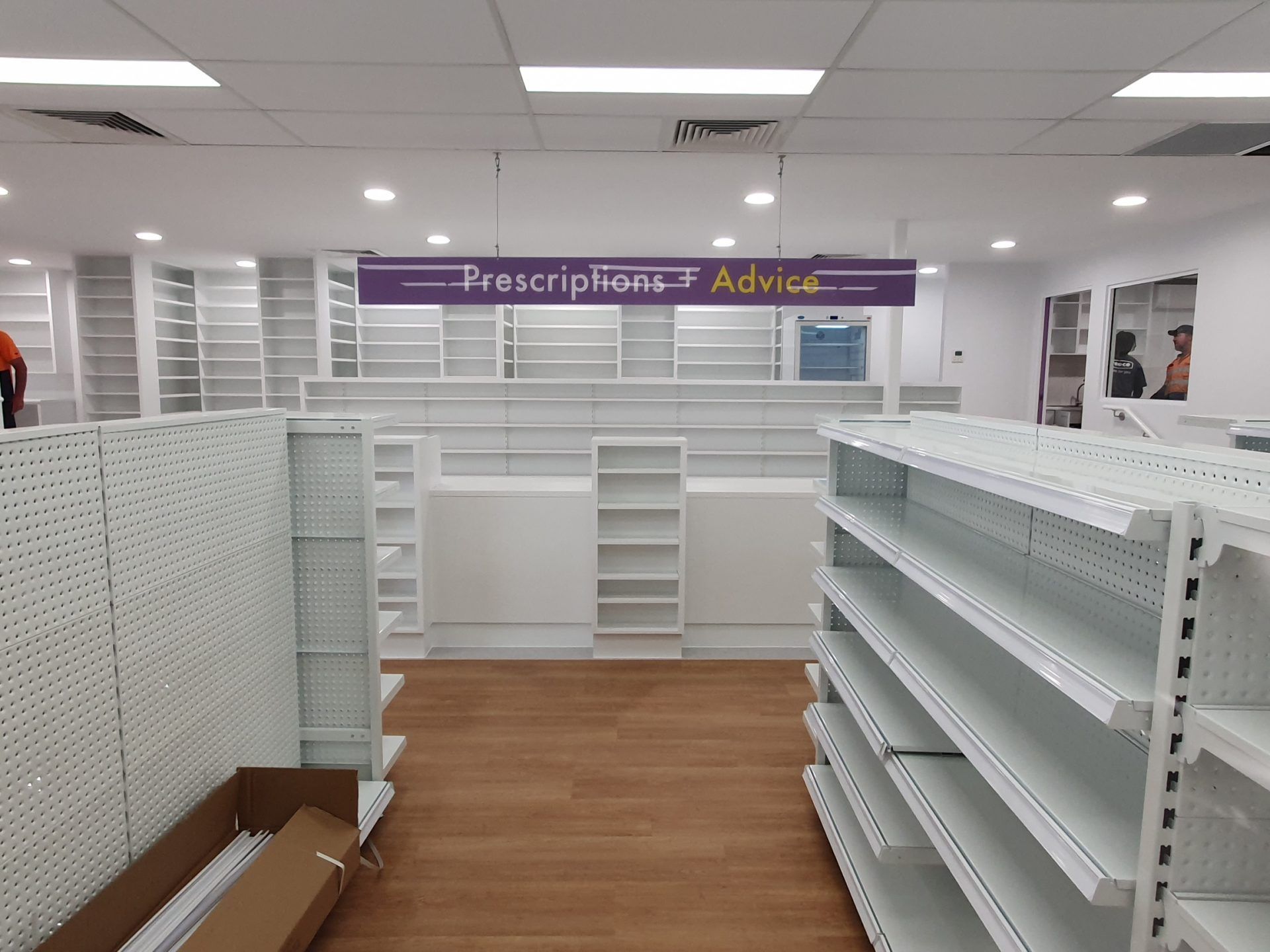 Empty pharmacy interior with white shelving — Trim Joinery In Fountaindale, NSW