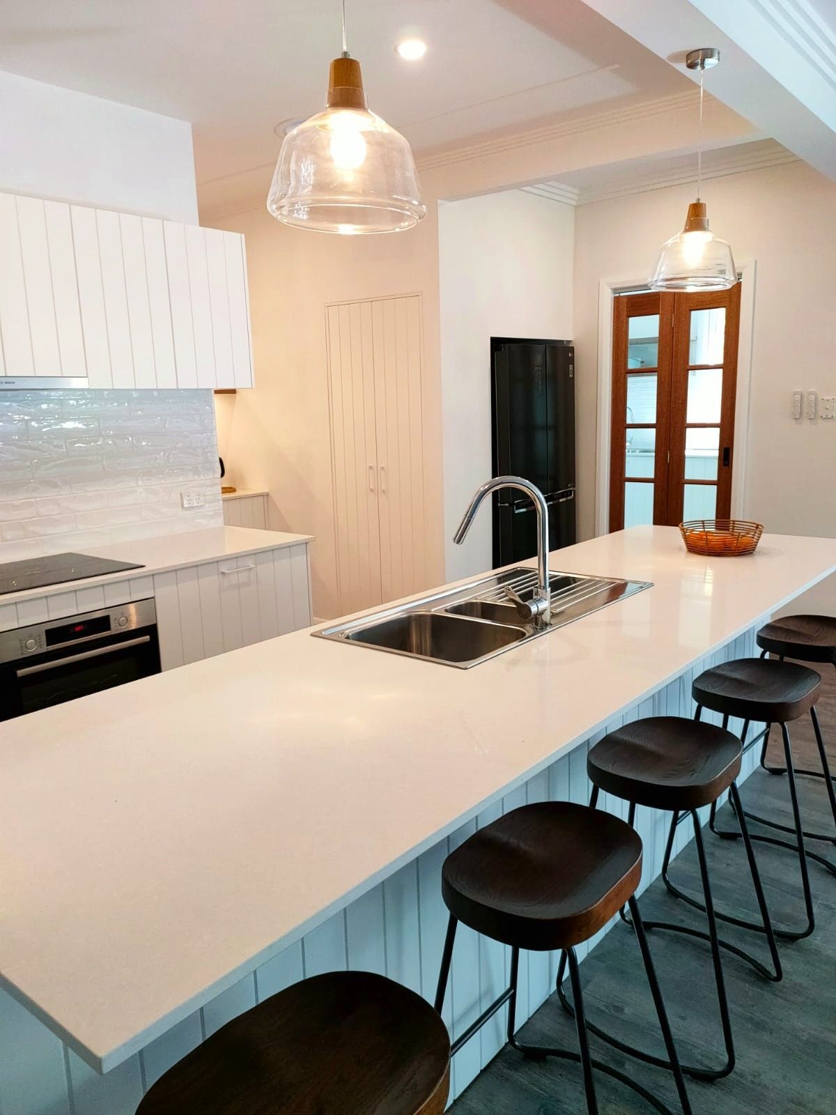 A Modern White Kitchen Island With a Sink — Trim Joinery In Singleton, NSW
