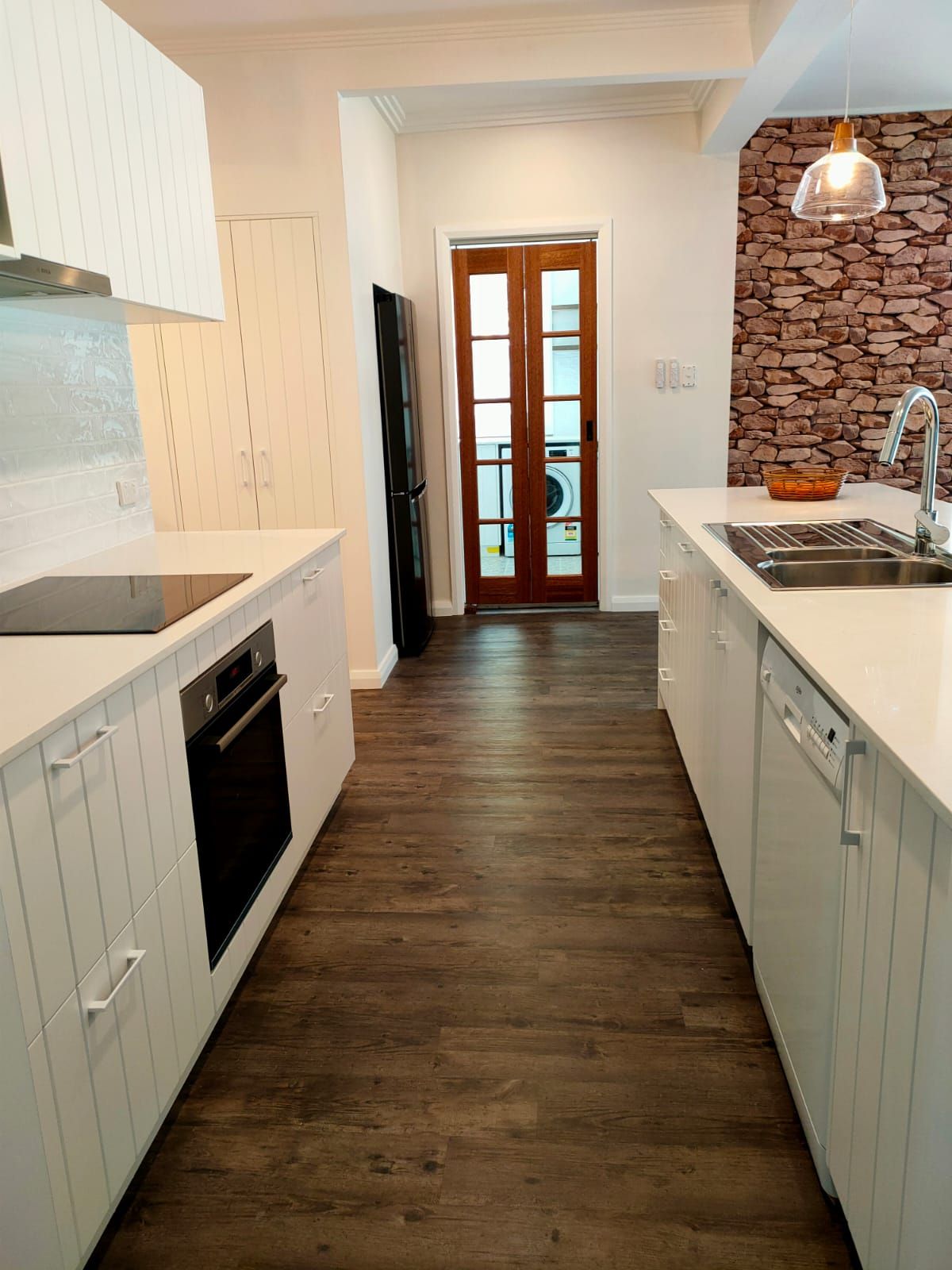 A Modern Kitchen With White Shaker Cabinets — Trim Joinery In Singleton, NSW