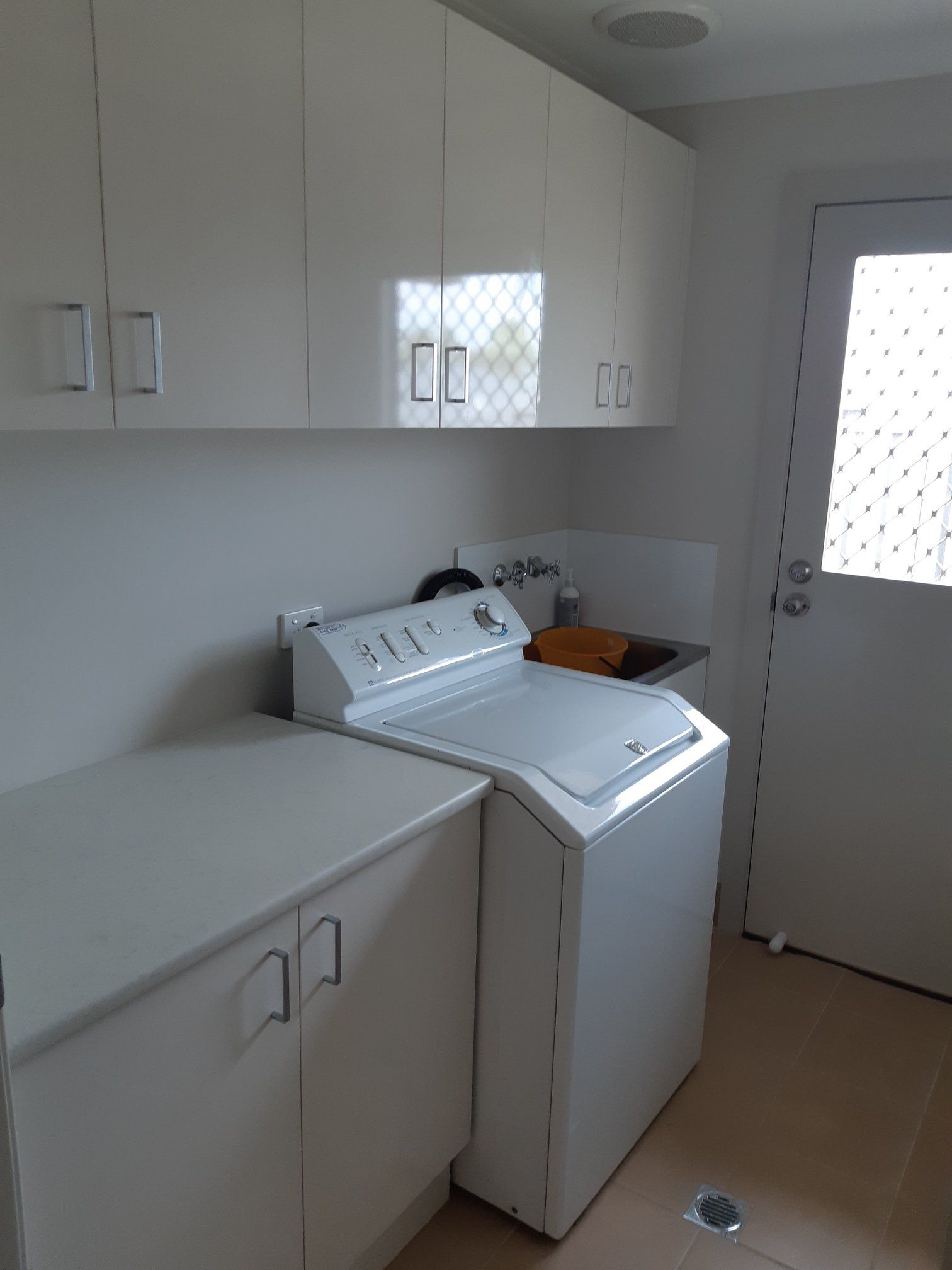 White Laundry Room With Washing Machine — Trim Joinery In Lake Macquarie, NSW