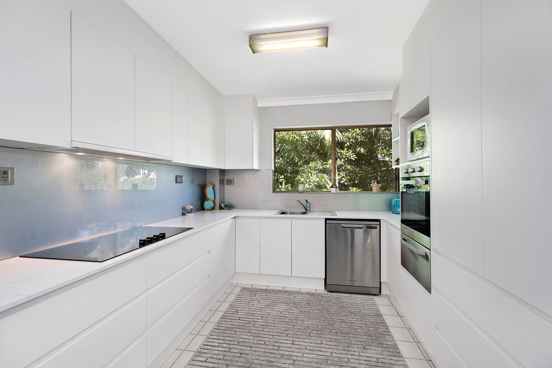 White Modern Kitchen With Cabinets — Trim Joinery In Fountaindale, NSW