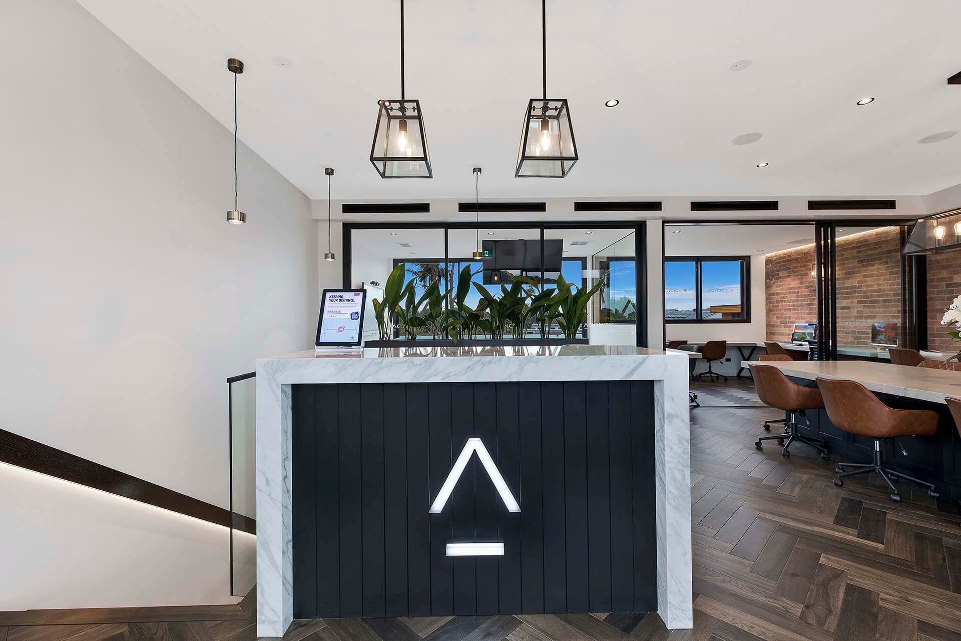 Modern Office Reception Area With a Black and White Counter — Trim Joinery In Lake Macquarie, NSW