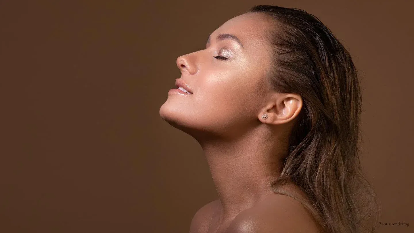 Woman with wet hair, head tilted back, eyes closed, against a brown background, appears serene.