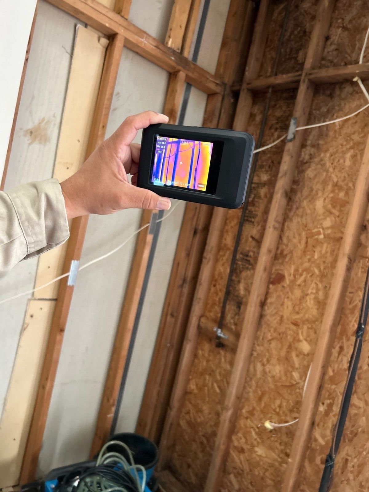 Thermal camera scanning opened walls for hidden moisture