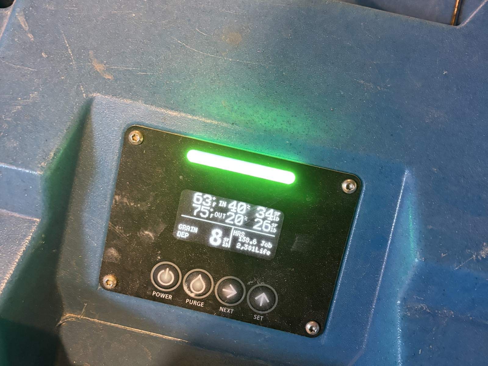 Dehumidifier control panel showing drying readings for documentation