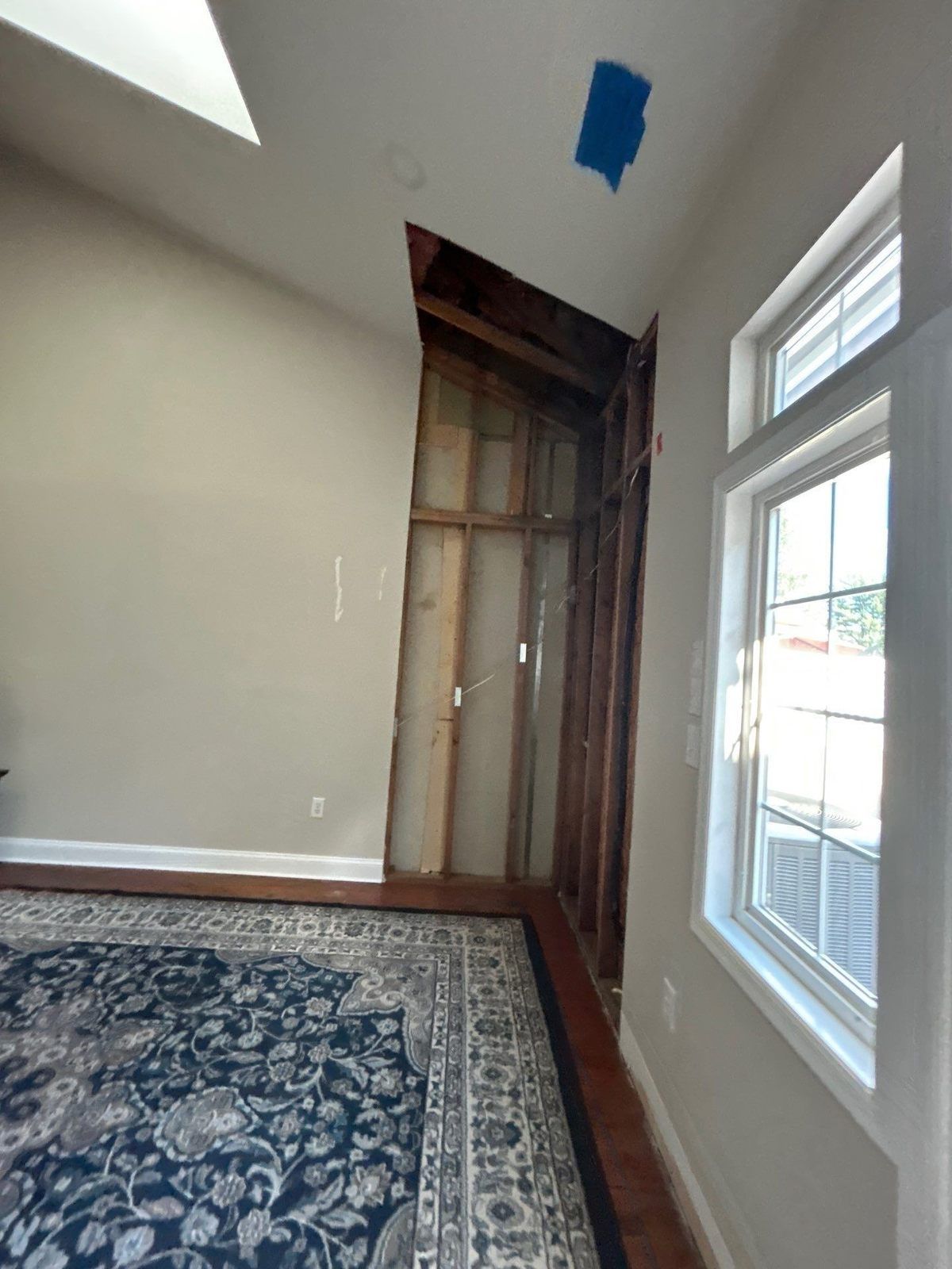 Vaulted ceiling and wall corner opened to the framing after water damage