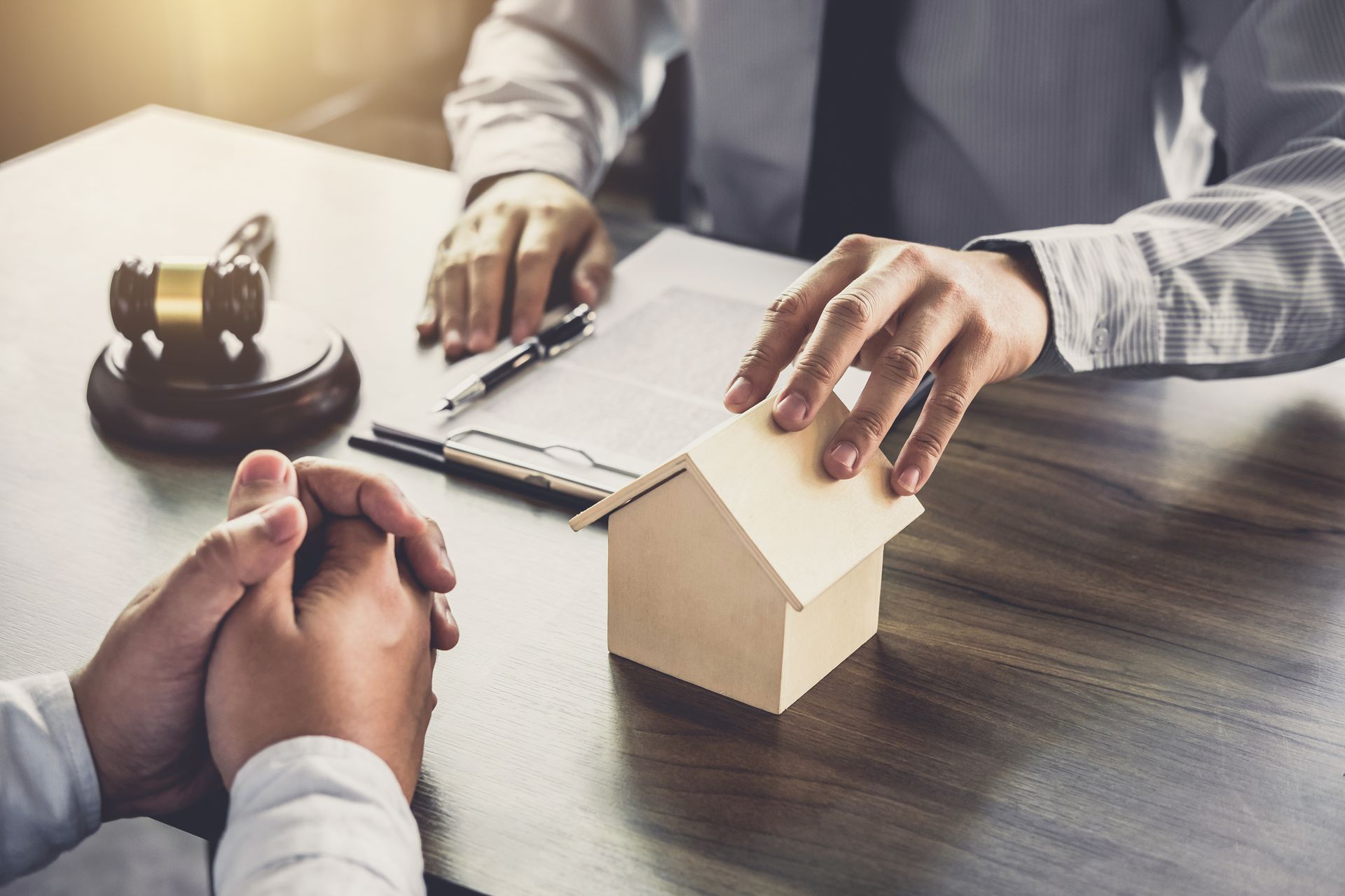 Male lawyer with client and working with Law books.