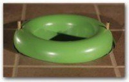 Green inflatable inner tube on a tiled floor