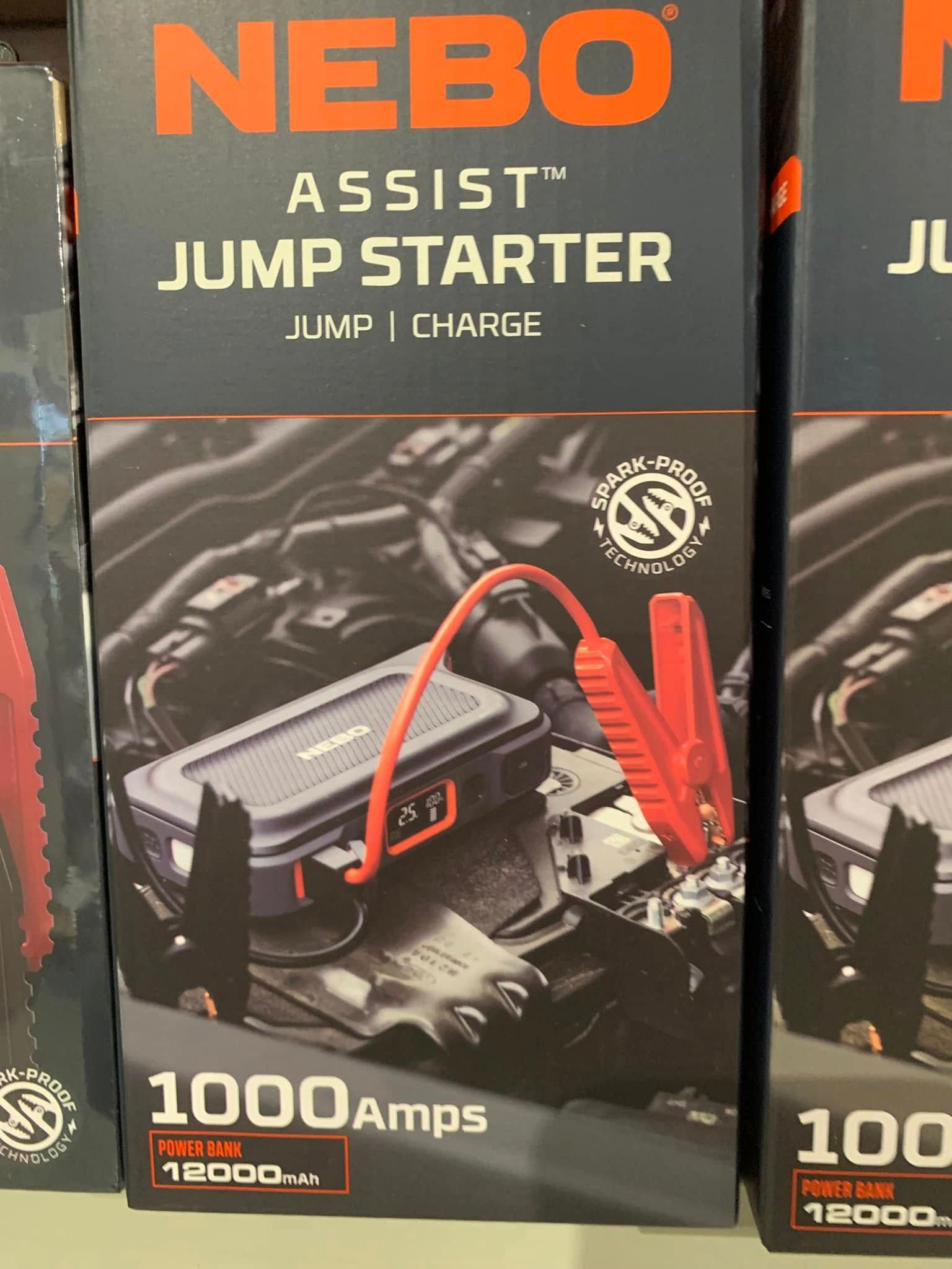 NEBO Assist jump starter and power bank box, black with orange accents and red jumper cables shown