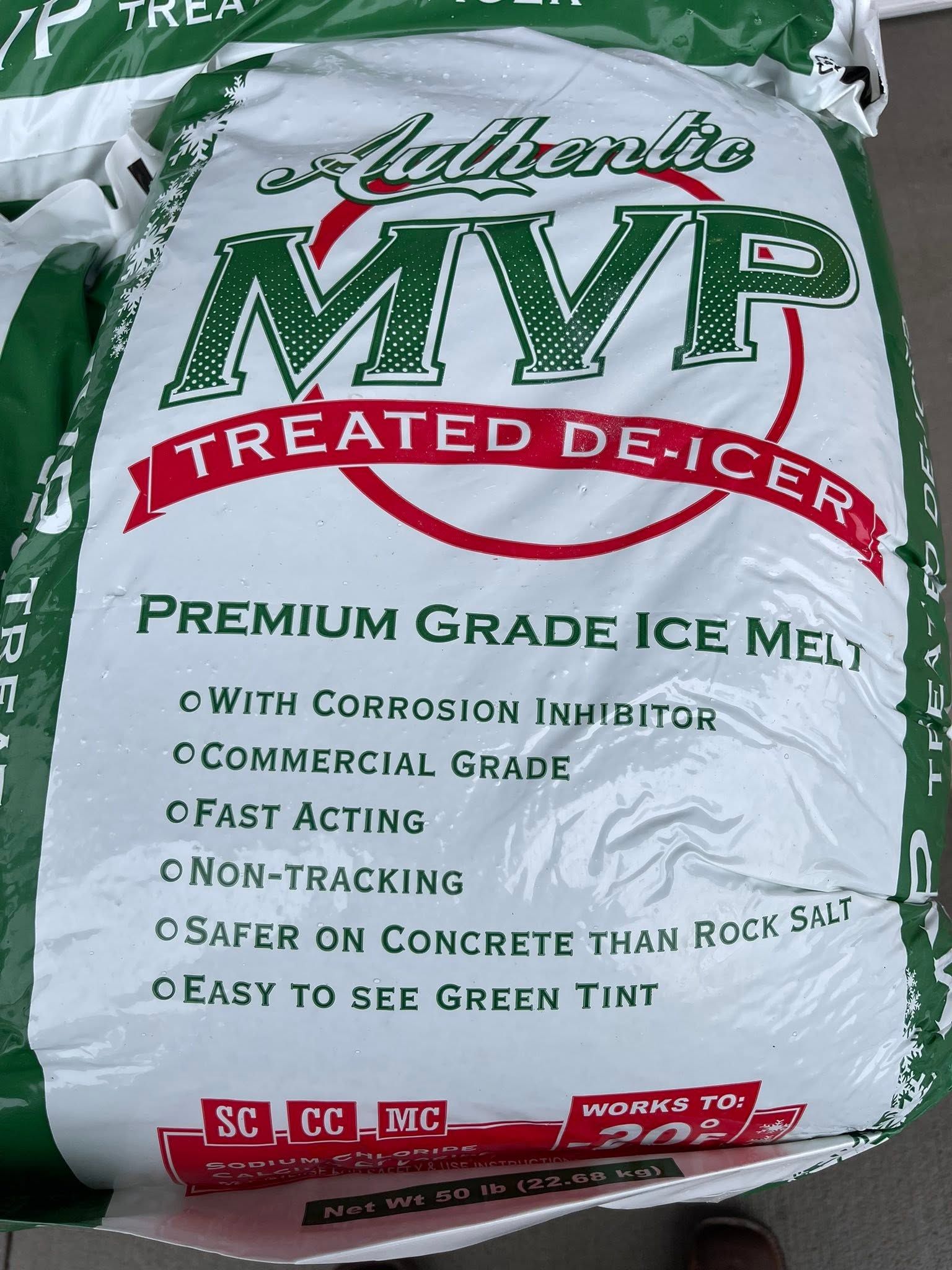 Bag of Miracle-Gro Moisture Control potting soil, green and white packaging, lying on the ground