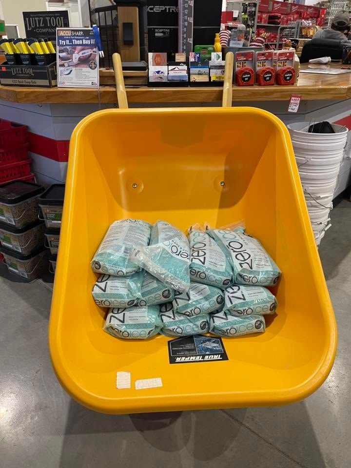 Yellow store bin filled with bundles of cash behind a checkout counter