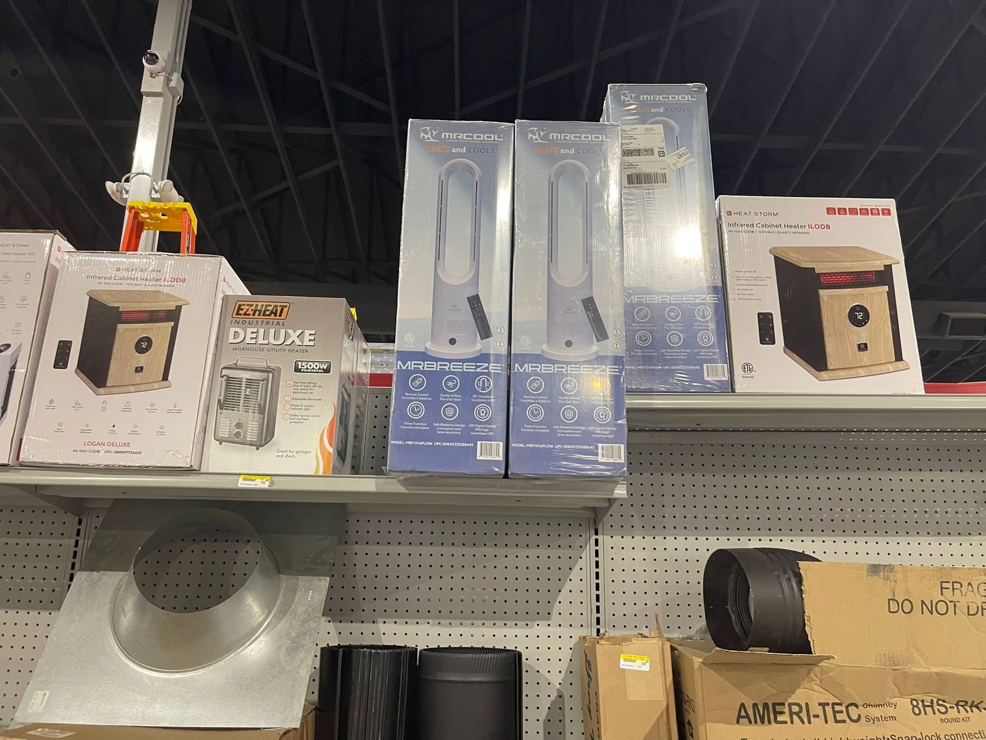 Store shelf with boxed home goods and lamps in white and blue packaging
