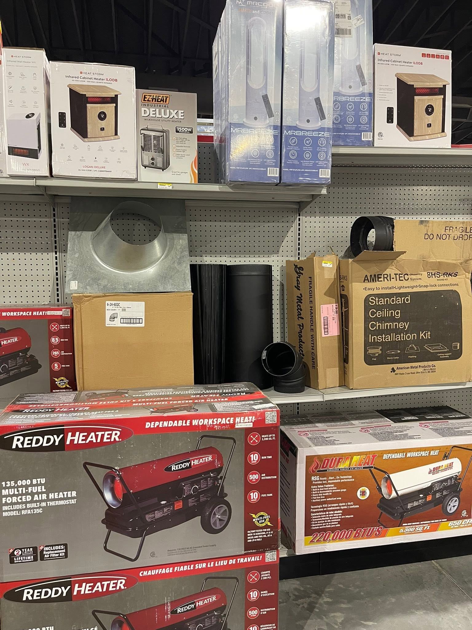Store shelf with assorted boxed household items and toys, including a red toy truck on the bottom shelf.