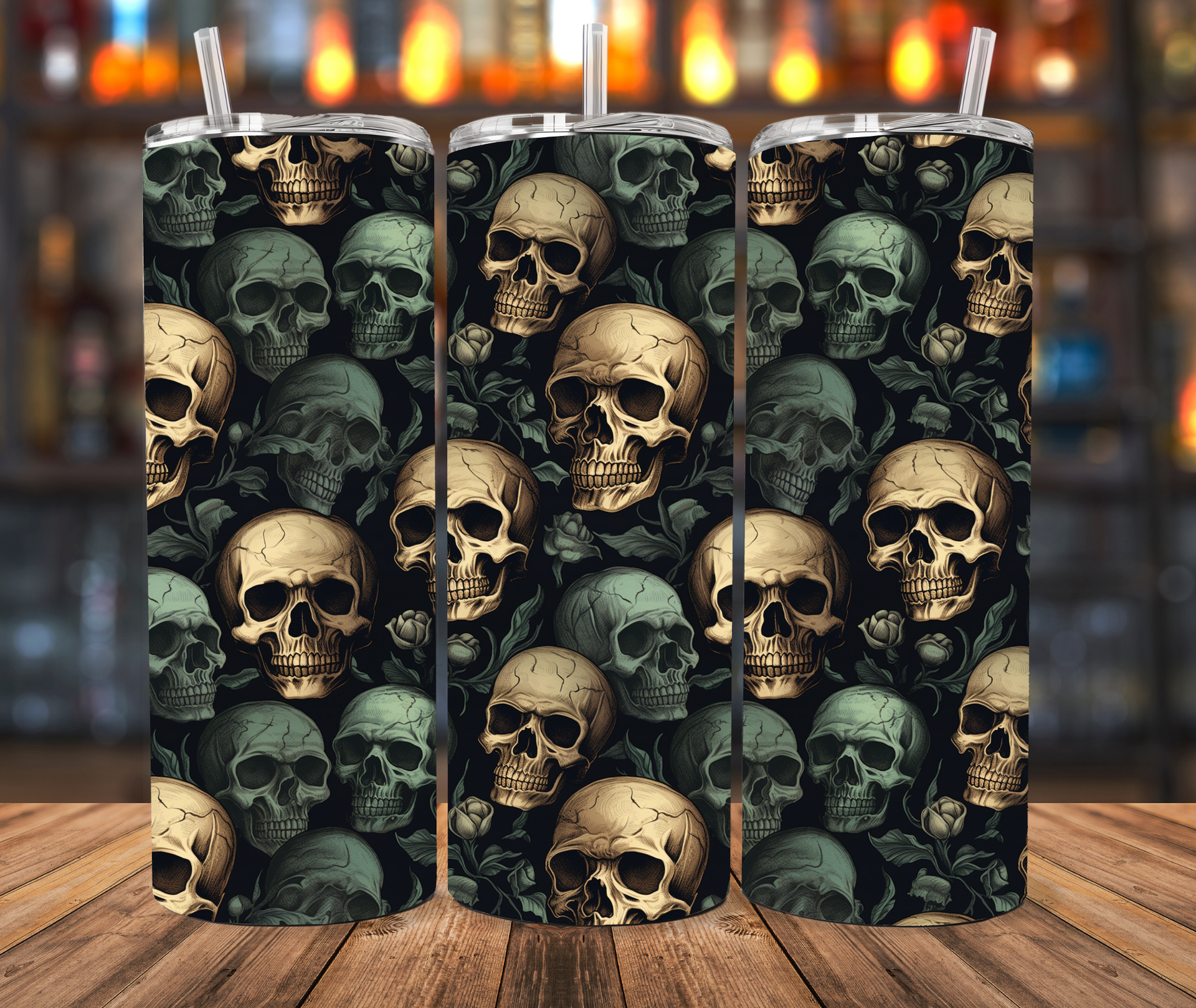 Three tumblers featuring an all-over dark pattern of beige skulls and roses against a black background on a wood surface.