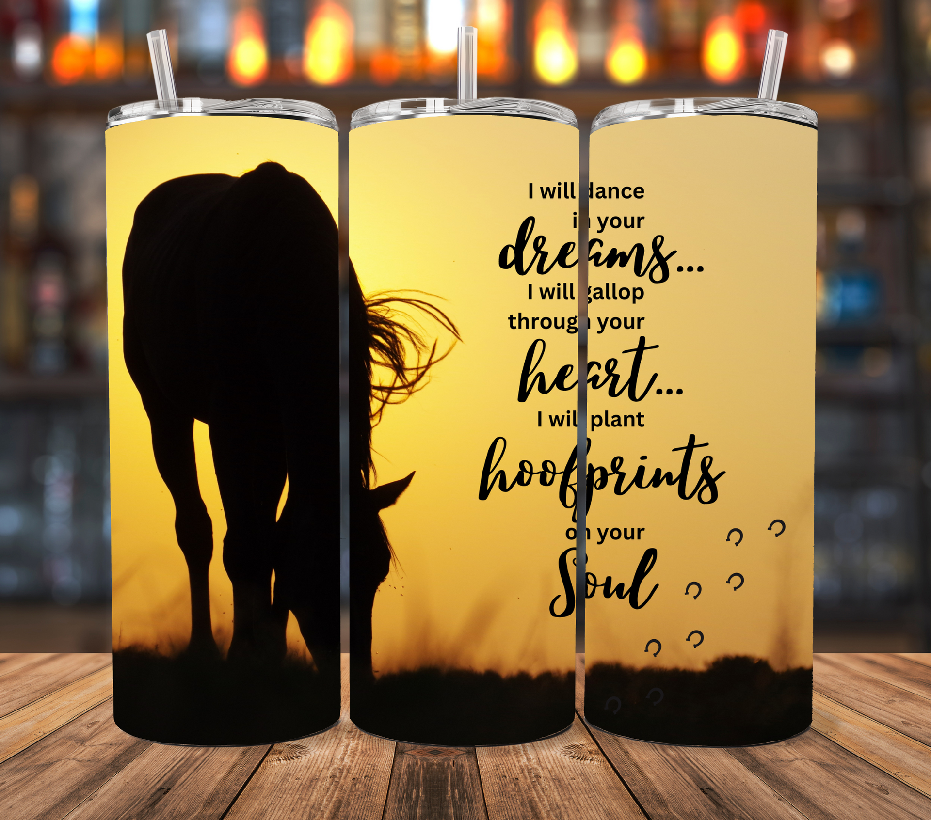 A tumbler featuring a horse silhouette against a yellow sunset with the text, 