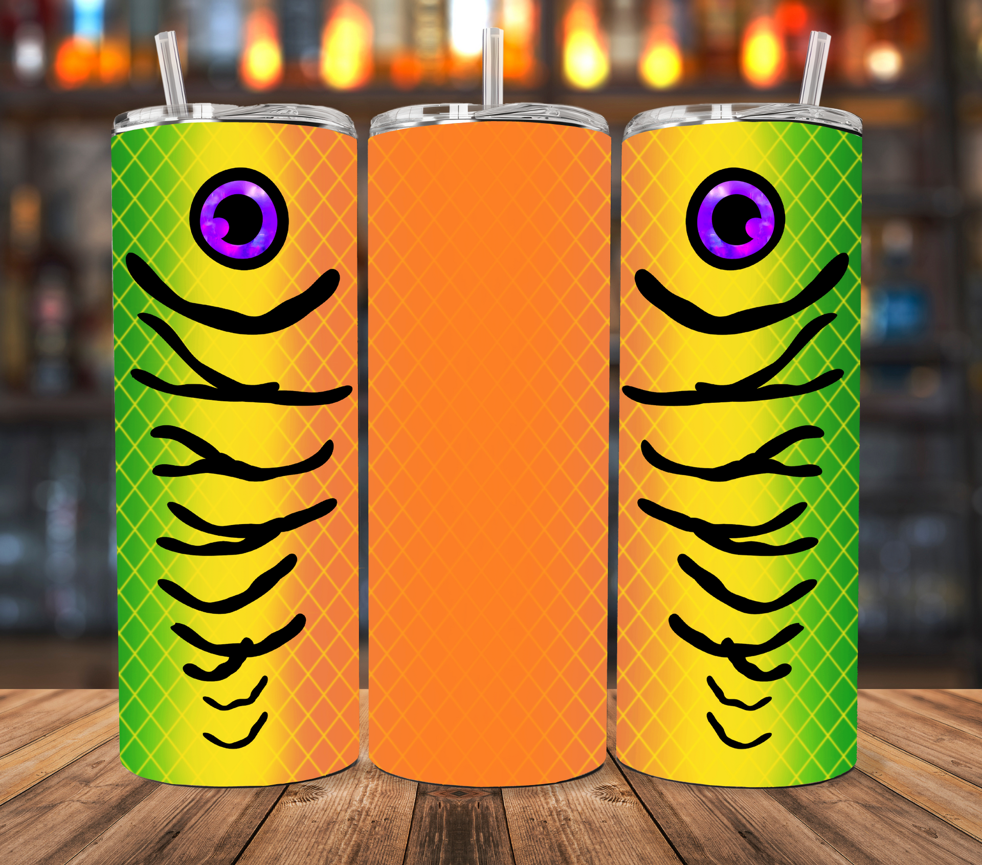 Three views of a tumbler featuring a bright yellow and green fish-scale pattern with a purple eye and black gill stripes.