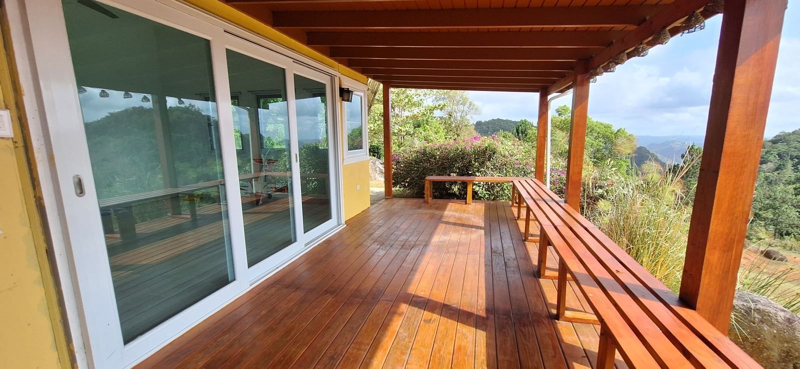 Sliding glass doors open the living area onto the deck