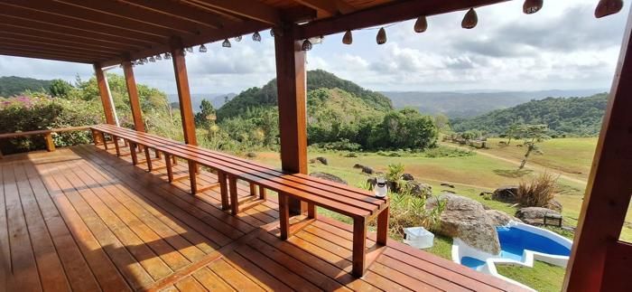 Refinished mahogany deck with built-in benches overlooking the valley