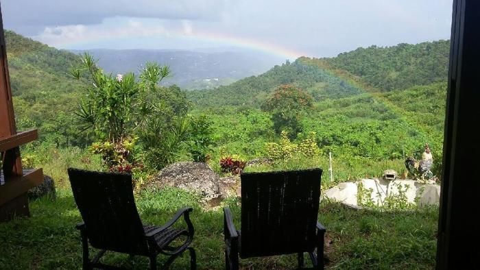 Rainbow over the valley from two chairs on the deck