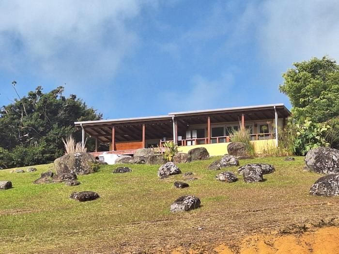 Main residence and boulder-studded lawn