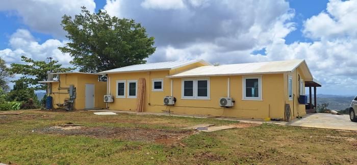 Rear elevation of the freshly painted main residence