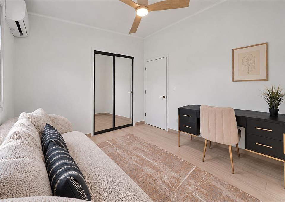 Office or guest room with desk and daybed