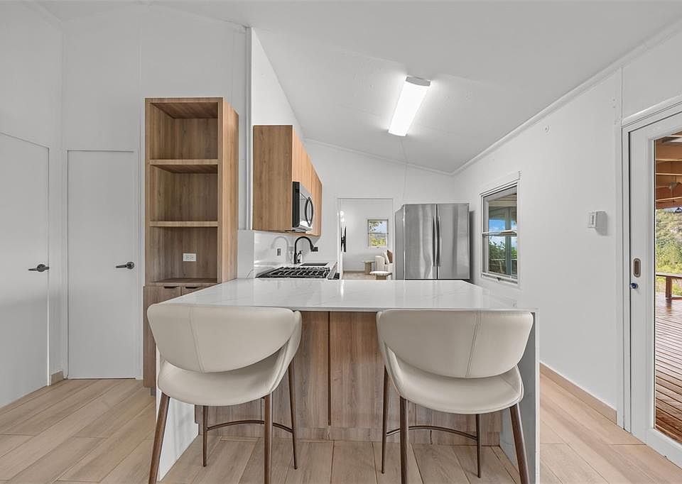 Kitchen island and light wood cabinetry