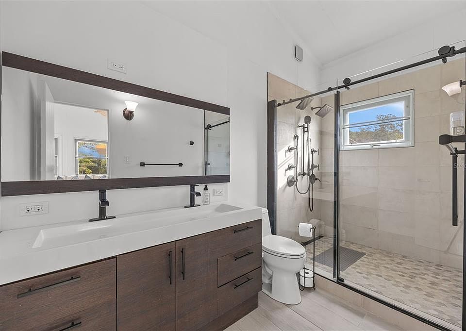 Bathroom with double vanity and glass shower