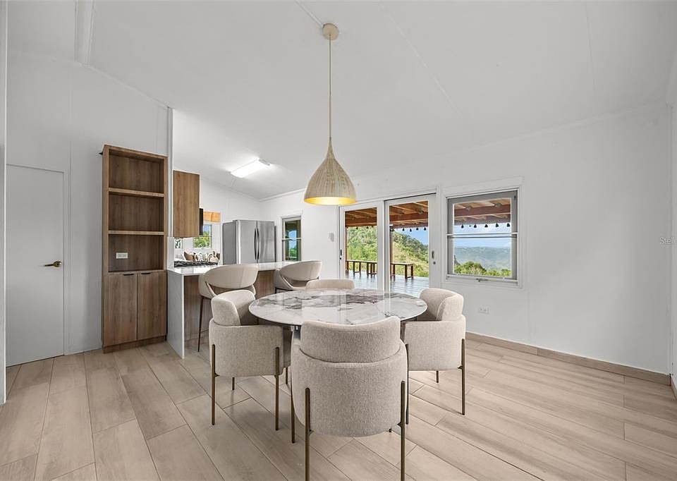 Dining area with round table and open shelving