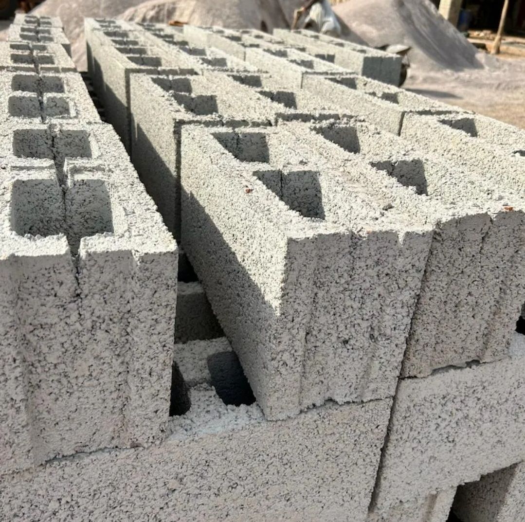 A pile of concrete blocks are stacked on top of each other.
