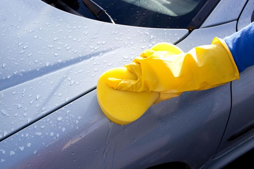 man uses sponge for washing