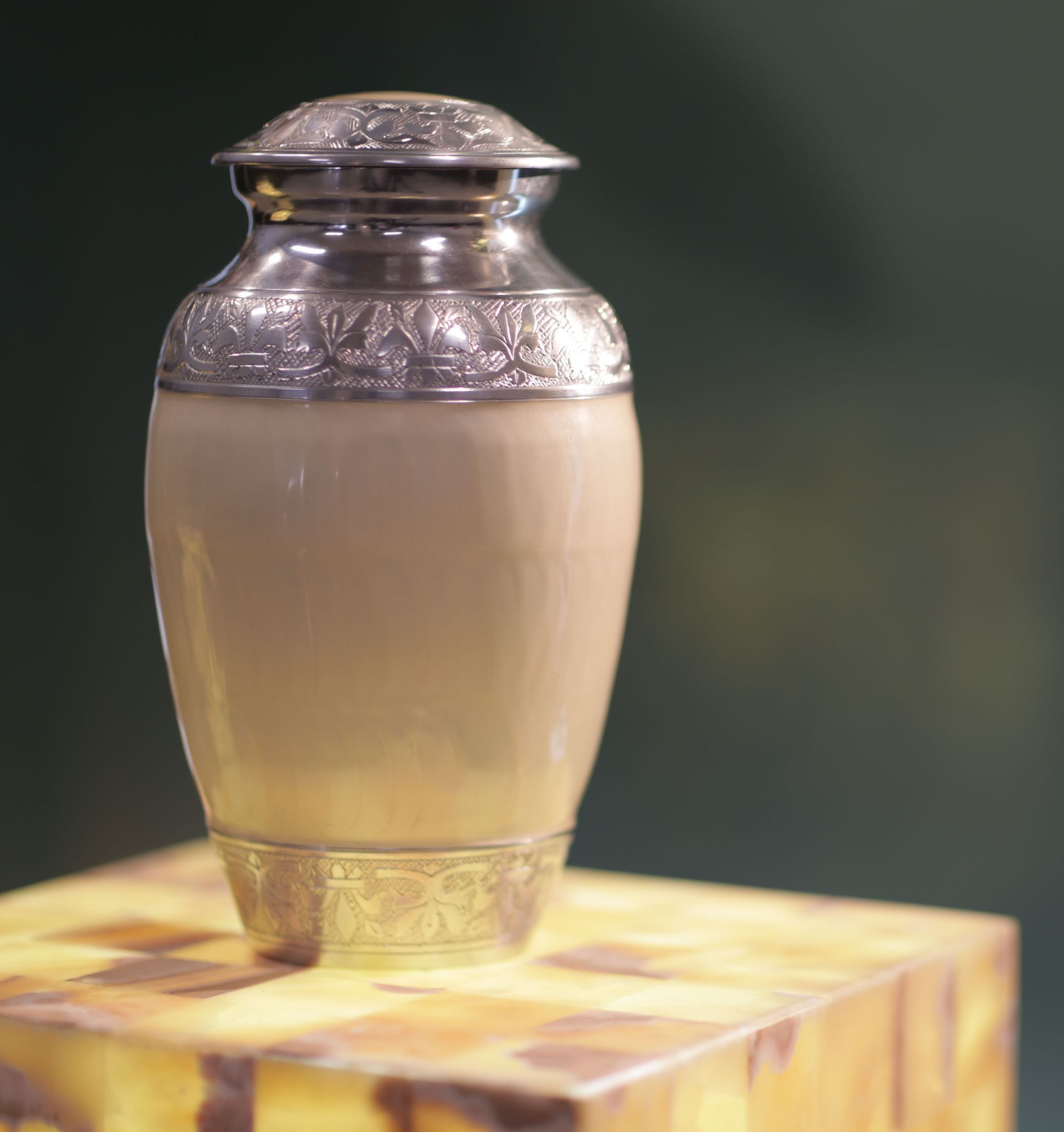 a vase is sitting on top of a wooden box .