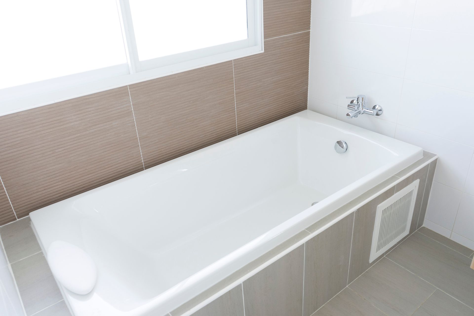 Freshly reglazed bathtub in a clean, updated bathroom in a Montclair, New Jersey home.