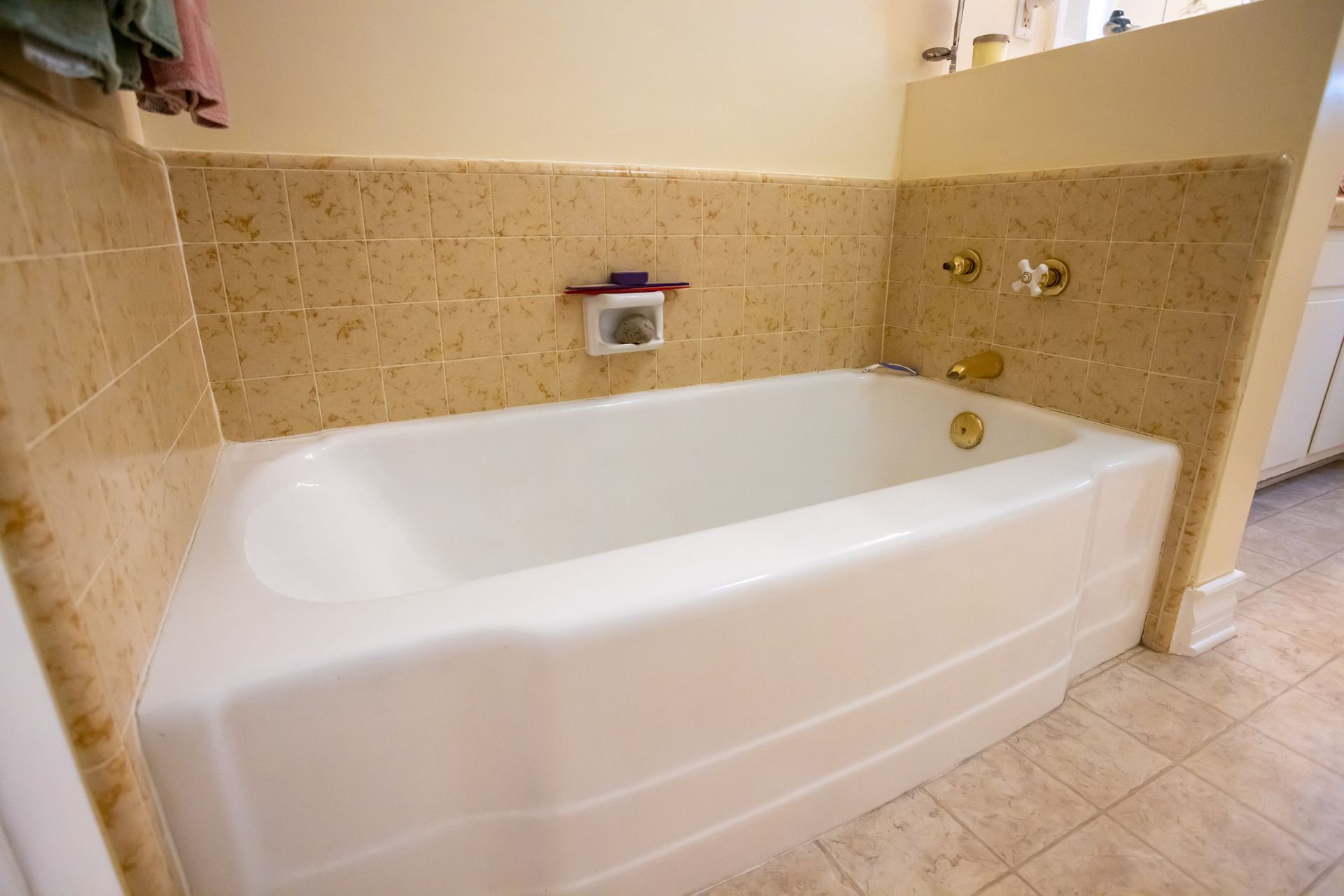 Freshly refinished bathtub in remodeled bathroom in Montclair, New Jersey, with glossy finish.