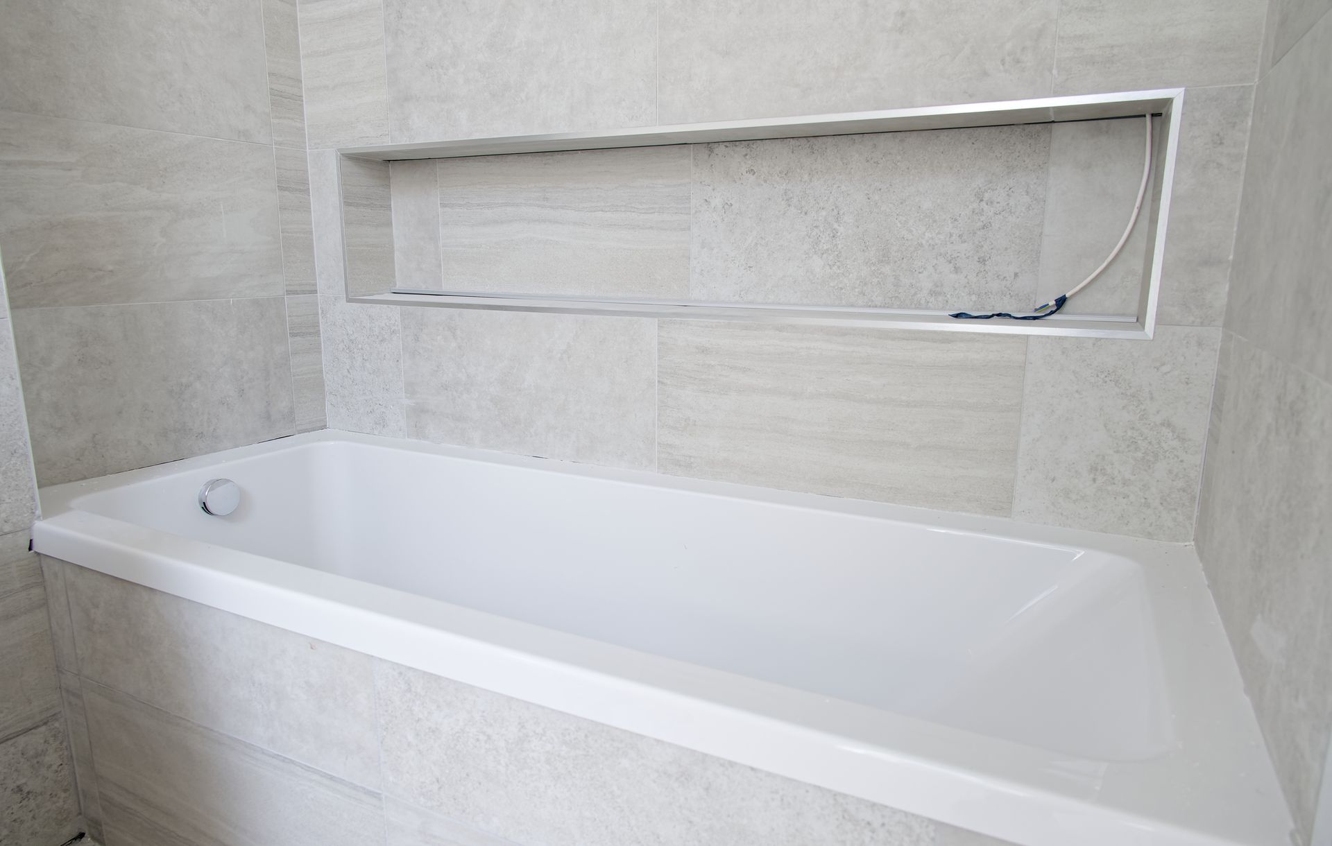 Bathtub reglazing process showing refinished tub surface in Montclair New Jersey renovation.