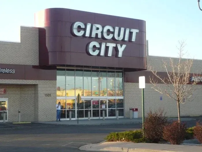 Circuit City storefront with large sign and glass entrance in a shopping center.