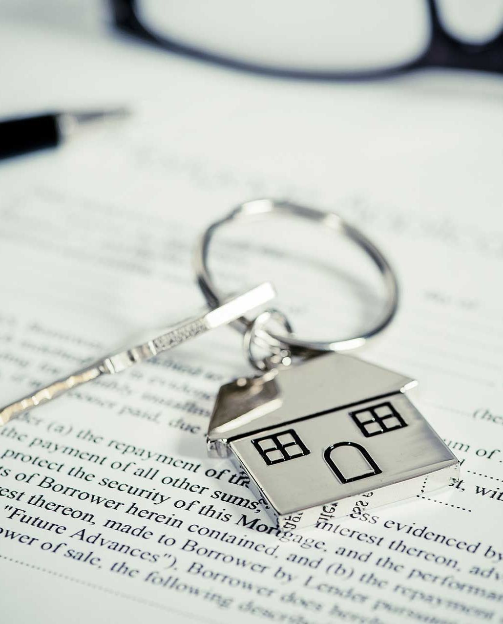 House Key Sitting Atop Legal Document
