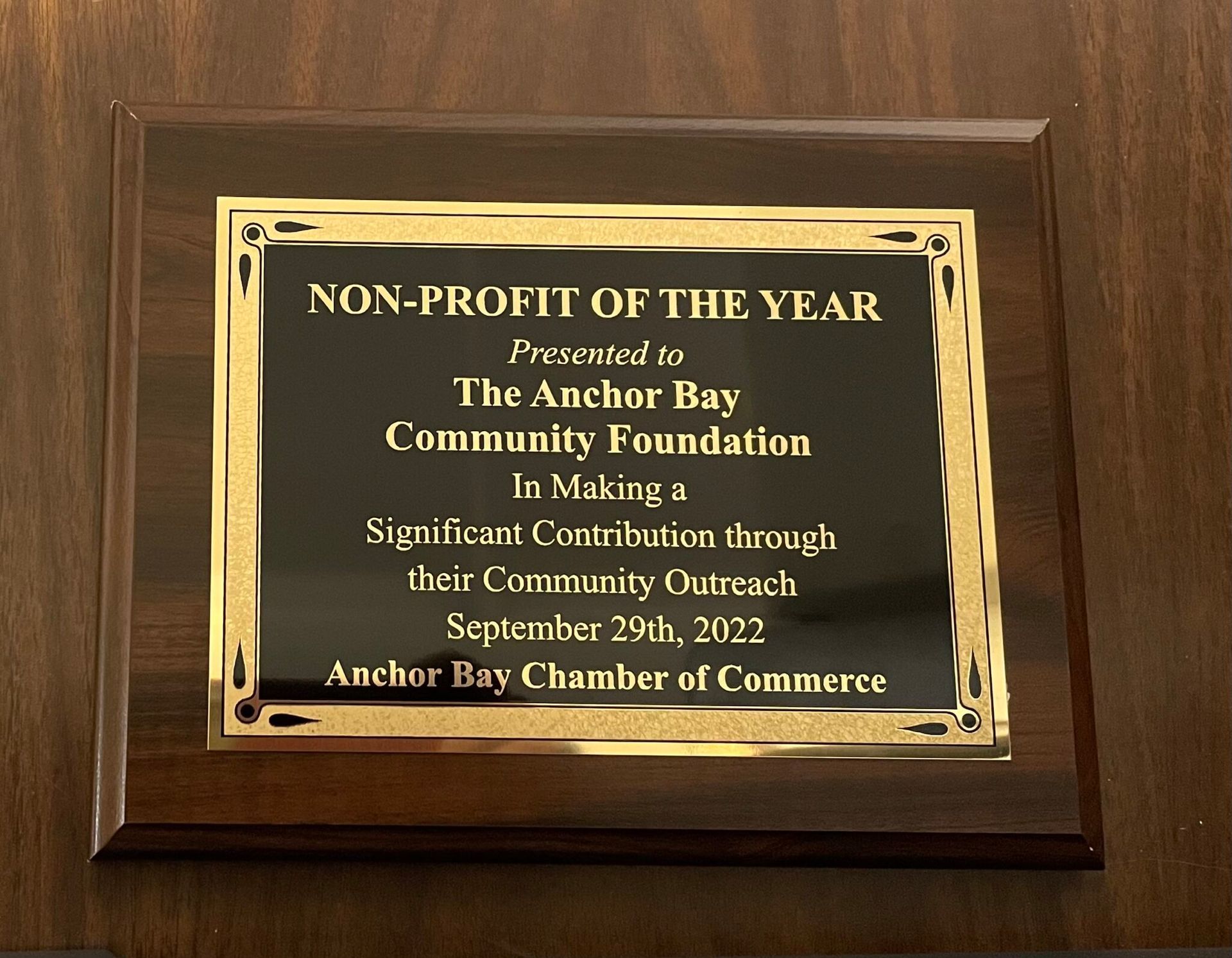 A plaque that says Non-Profit Of The Year presented to the Anchor Bay Community Foundation.
