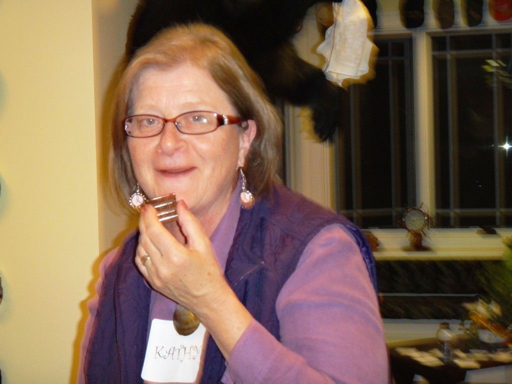 A woman eating a piece of chocolate.