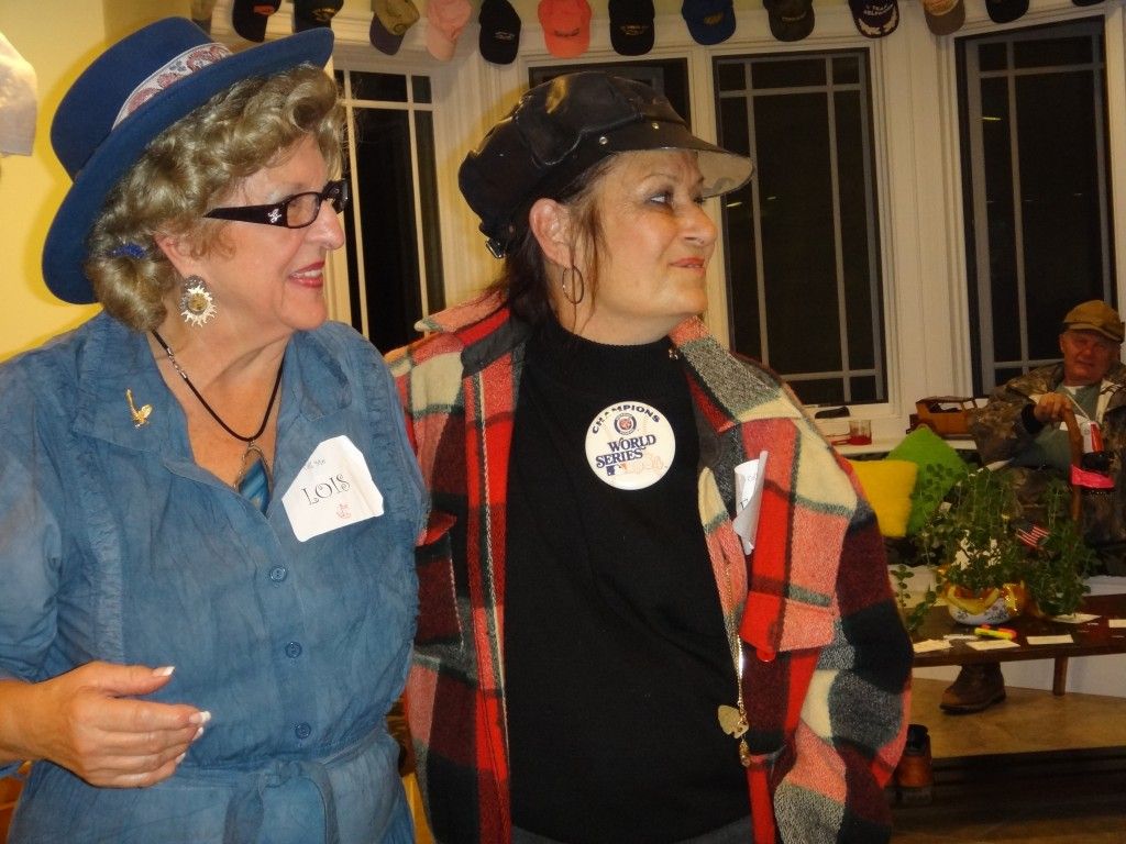 Two women standing next to each other with one wearing a World Series badge.