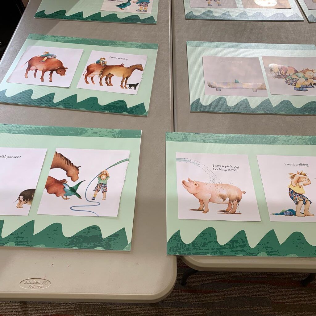 Pages of children's books pasted across posters.