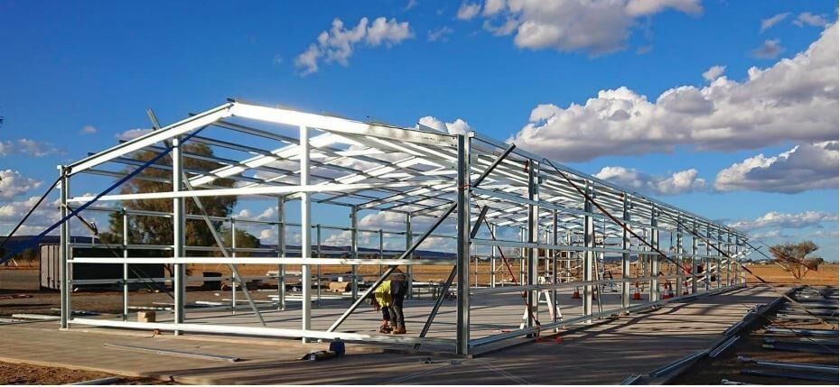 A Large Metal Structure Is Being Built In The Middle Of A Field — Alice Sheds & Structures In Ciccone, NT
