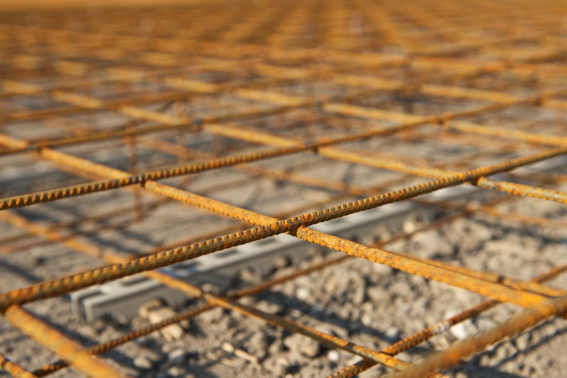 A close up of a metal mesh on a construction site. A close up of a metal mesh on a construction site.