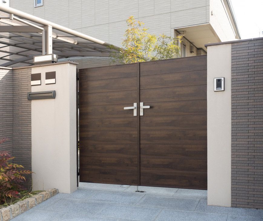 Automatic Brown Wooden Double Gates— Coastal Auto Garage Doors & Gates In Morayfield, QLD